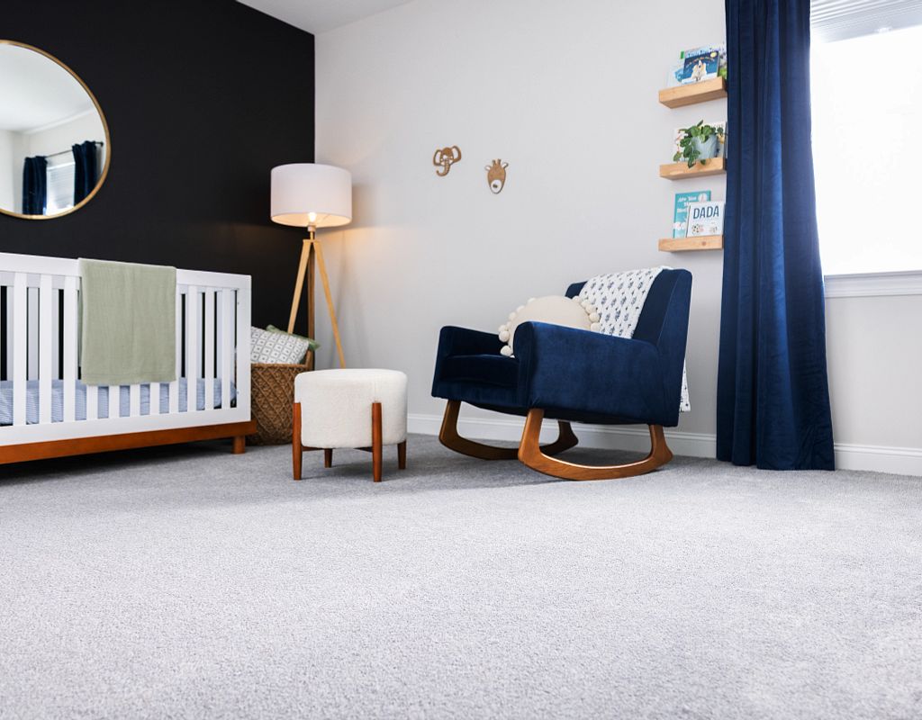 Carpet flooring with blue couch | West River Carpets
